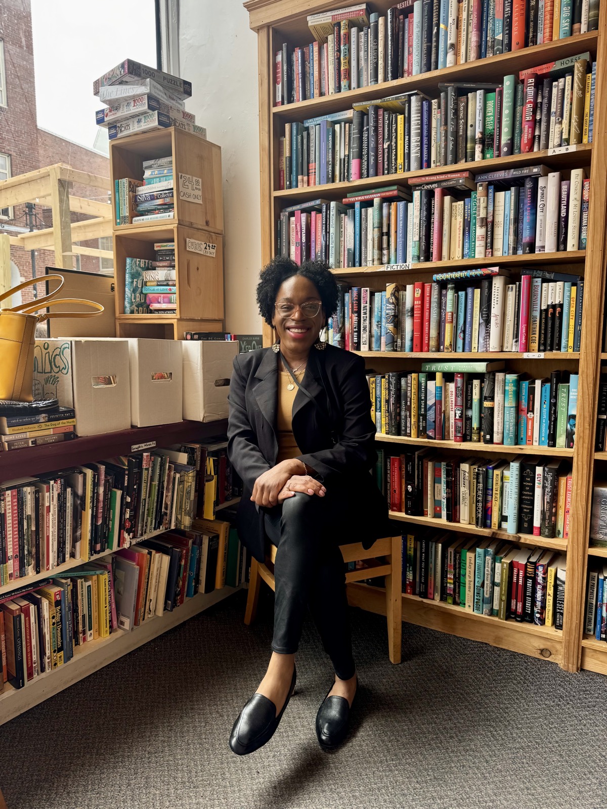 Javonni Flewellen, founder of Dream Design Studio, in a bookstore